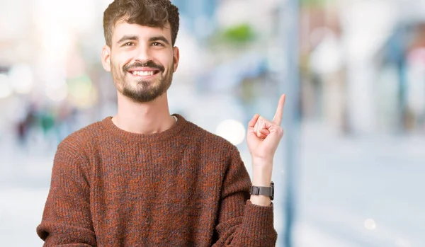 Jonge Knappe Man Winter Trui Dragen Geïsoleerde Achtergrond Met Een — Stockfoto