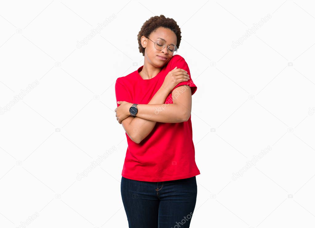 Beautiful young african american woman wearing glasses over isolated background Hugging oneself happy and positive, smiling confident. Self love and self care