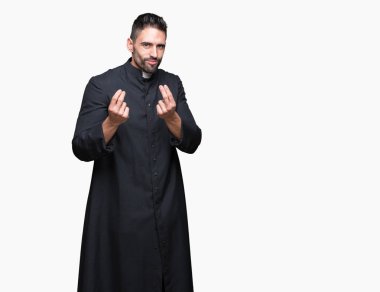 Genç Hıristiyan rahip izole arka plan üzerinde yapmak para hareketi el ile maaş ödeme için milyoner iş istiyor