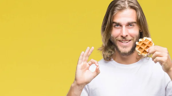 Young Handsome Man Long Hair Isolated Background Eating Waffle Doing — Stock Photo, Image