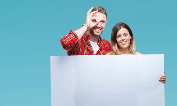 Young Couple Together Holding Blank Banner Isolated Background Happy Face — Stock Photo, Image