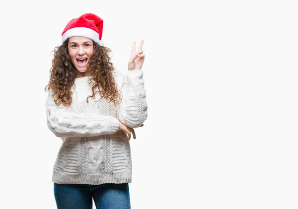 Chica Morena Joven Con Sombrero Navidad Sobre Fondo Aislado Sonriendo —  Fotos de Stock