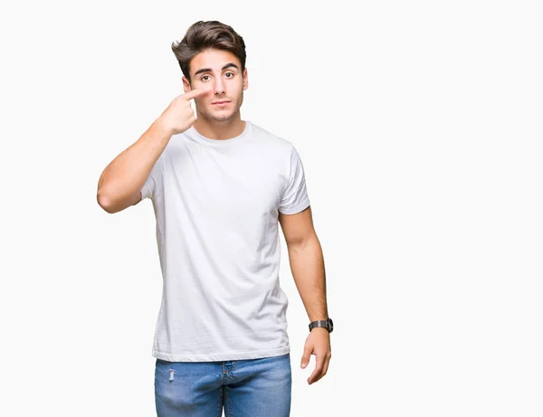 Jovem Homem Bonito Vestindo Camiseta Branca Sobre Fundo Isolado Apontando — Fotografia de Stock