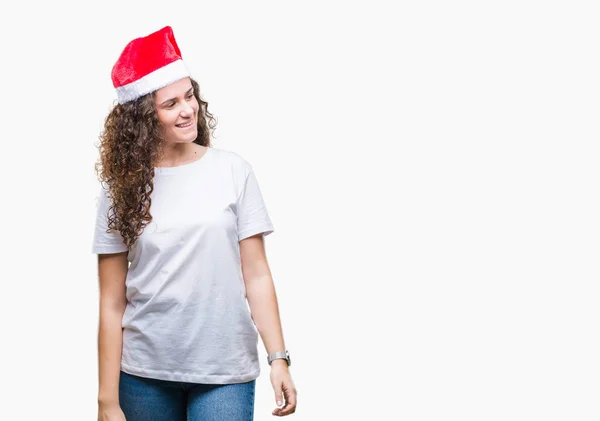 Chica Morena Joven Con Sombrero Navidad Sobre Fondo Aislado Mirando — Foto de Stock