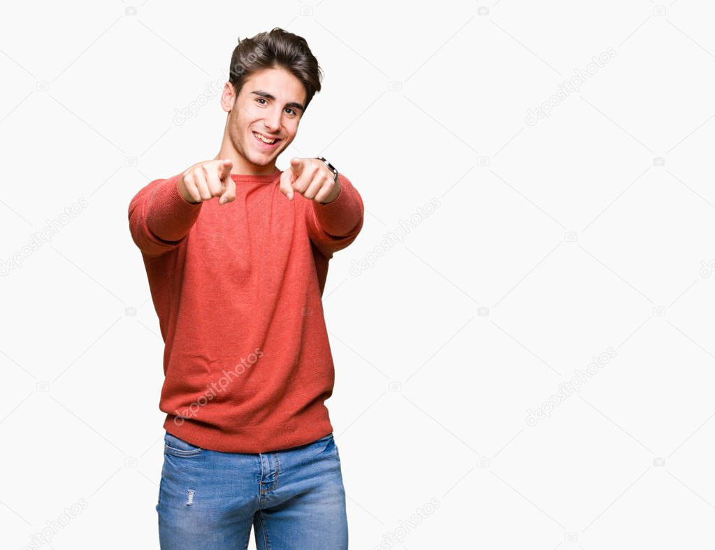 Young handsome man over isolated background Pointing to you and the camera with fingers, smiling positive and cheerful