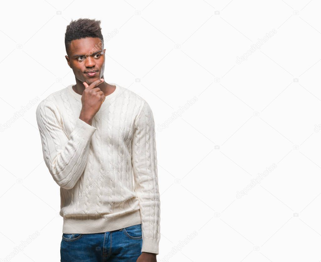 Young african american man over isolated background with hand on chin thinking about question, pensive expression. Smiling with thoughtful face. Doubt concept.
