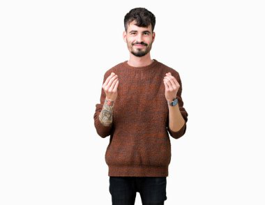 Maaş ödeme için milyoner iş soran izole arka plan yapıyor para hareketi el ile üzerinden kış kazak giyen genç yakışıklı adam