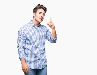 Genç yakışıklı iş adamı ile başarılı fikir parmağı yukarıyı izole arka plan üzerinde. Çıktıktan ve mutlu. Bir numara.