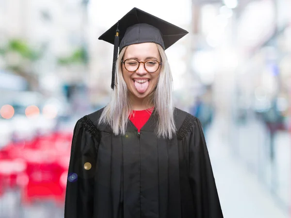 Young Blonde Woman Wearing Graduate Uniform Isolated Background Sticking Tongue — Stock Photo, Image