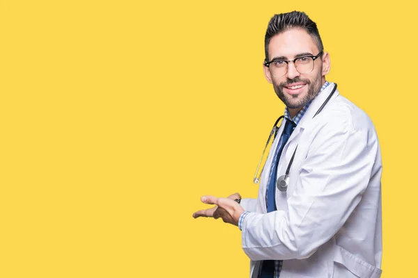 Handsome Young Doctor Man Isolated Background Inviting Enter Smiling Natural — Stock Photo, Image