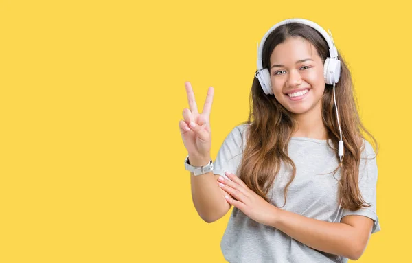 Mooie Jongedame Koptelefoon Luisteren Naar Muziek Geïsoleerde Achtergrond Glimlachend Met — Stockfoto