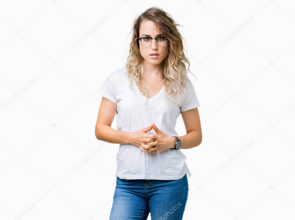 Beautiful young blonde woman wearing glasses over isolated background Hands together and fingers crossed smiling relaxed and cheerful. Success and optimistic