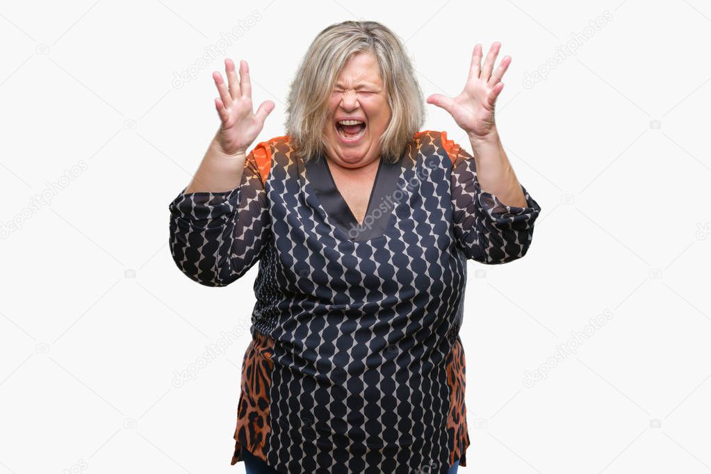Senior plus size caucasian woman over isolated background celebrating crazy and amazed for success with arms raised and open eyes screaming excited. Winner concept