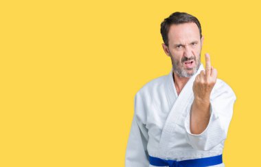 Handsome middle age senior man wearing kimono uniform over isolated background Showing middle finger, impolite and rude fuck off expression clipart