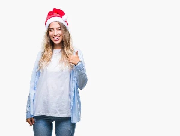 Mooie Jonge Blonde Vrouw Kerstmuts Dragen Geïsoleerde Achtergrond Gelukkig Duimschroef — Stockfoto