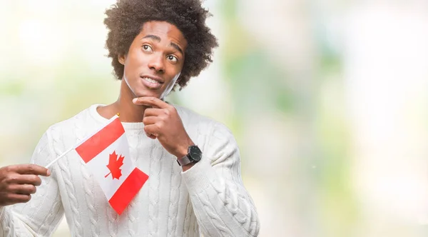 加拿大黑人美国男子国旗在孤立背景严重的面孔思考问题 非常混淆的想法 — 图库照片