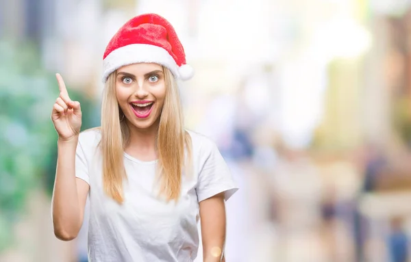 Jonge Mooie Blonde Vrouw Kerstmuts Geïsoleerde Achtergrond Vinger Omhoog Met — Stockfoto