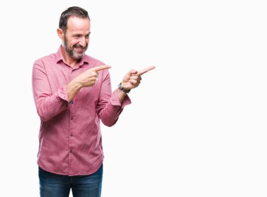 Orta yaş ağarmış komuta sizde gülümseyen ve iki elleri ve parmakları ile tarafına işaret kamera bakarak izole arka plan üzerinde.