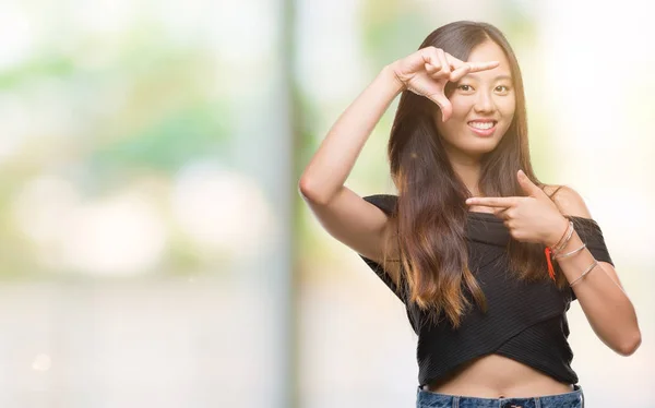 Young Asian Woman Isolated Background Smiling Making Frame Hands Fingers — Stock Photo, Image