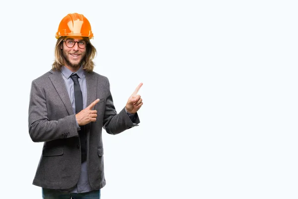 Young Handsome Architec Man Long Hair Wearing Safety Helmet Isolated — Stock Photo, Image