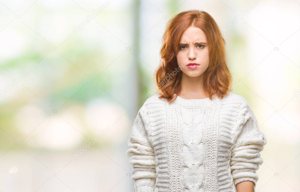 Young beautiful woman over isolated background wearing winter sweater skeptic and nervous, frowning upset because of problem. Negative person.
