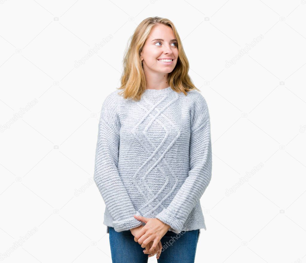Beautiful young woman wearing winter sweater over isolated background smiling looking side and staring away thinking.