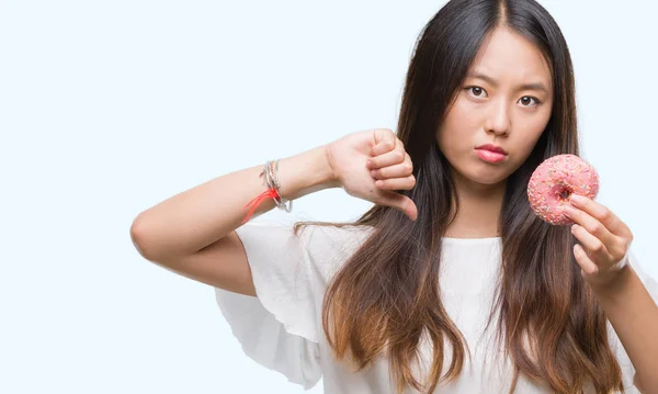 Young Asian Woman Eating Donut Isolated Background Angry Face Negative — Stock Photo, Image