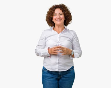 Güzel orta ager üst düzey businees kadın izole arka plan el ele tutusun ve rahat ve neşeli gülümseyen parmak çarpı işareti. Başarı ve iyimser