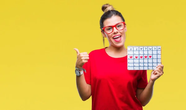 Joven Hermosa Mujer Sosteniendo Calendario Menstruación Sobre Fondo Aislado Señalando — Foto de Stock