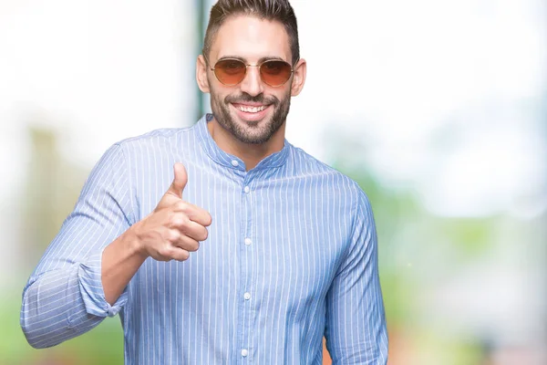 Young Handsome Man Wearing Sunglasses Isolated Background Doing Happy Thumbs — Stock Photo, Image