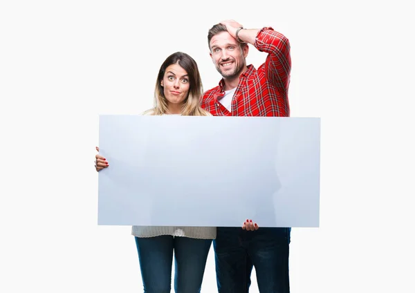 Young Couple Together Holding Blank Banner Isolated Background Stressed Hand — Stock Photo, Image