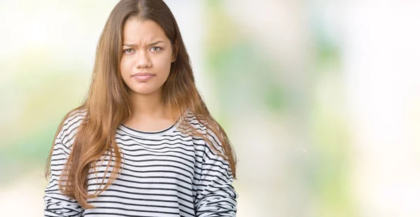 Young Beautiful Brunette Woman Wearing Stripes Sweater Isolated Background Skeptic — Stock Photo, Image