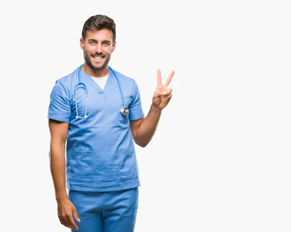 Mladý Pohledný Doktor Chirurg Muž Izolované Pozadí Usmívající Smajlík Mrkl — Stock fotografie