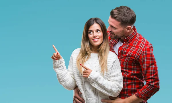 恋分離背景笑顔で側に つの手と指で指しているカメラ目線の上冬のセーターを着ている若いカップル — ストック写真
