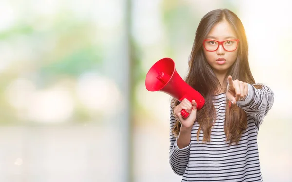 Young Asian Woman Holding Megaphone Isolated Background Pointing Finger Camera — Stock Photo, Image