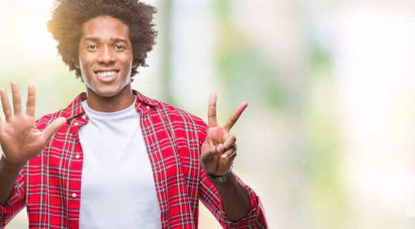 Afro american man over isolated background showing and pointing up with fingers number seven while smiling confident and happy.