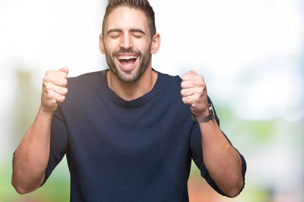 Junger Gutaussehender Mann Der Pullover Über Isoliertem Hintergrund Trägt Und — Stockfoto