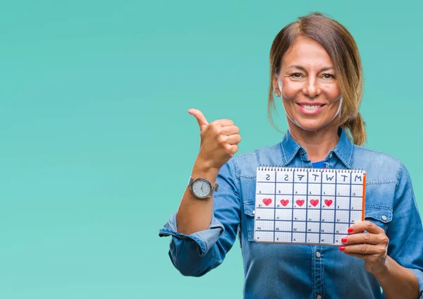 Mulher Hispânica Sênior Meia Idade Segurando Calendário Menstruação Sobre Fundo — Fotografia de Stock