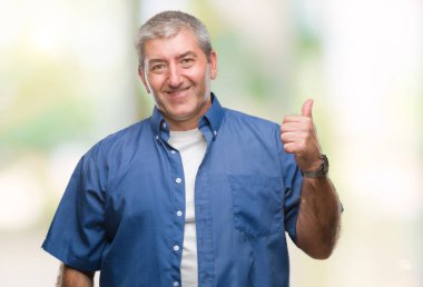 Hareketi el ile mutlu yaşasın yapıyor izole arka plan üzerinde yakışıklı komuta sizde. Kameraya bakarak başarı gösteren ile ifade onaylama.