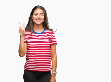 Genç güzel Arap kadın gösterilen ve parmakları ile işaret izole arka plan yüzünden kendinden emin ve mutlu gülümseyerek ise ikinci.