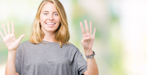 Beautiful young woman wearing oversize casual t-shirt over isolated background showing and pointing up with fingers number nine while smiling confident and happy.