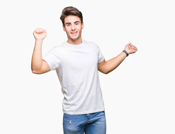 Mladý Pohledný Muž Sobě Bílé Tričko Izolované Pozadí Taneční Šťastný — Stock fotografie