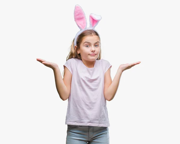 Junge Schöne Mädchen Mit Osterhasenohren Über Isoliertem Hintergrund Ahnungslos Und — Stockfoto