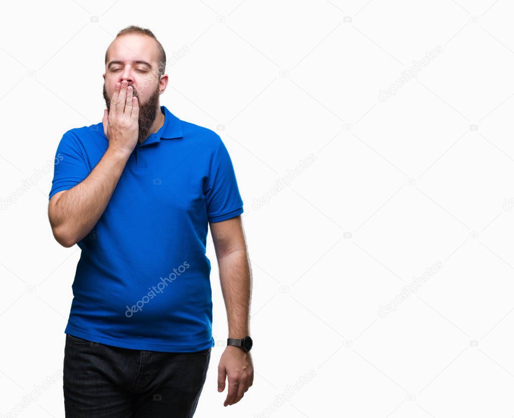 Young caucasian hipster man wearing blue shirt over isolated background bored yawning tired covering mouth with hand. Restless and sleepiness.