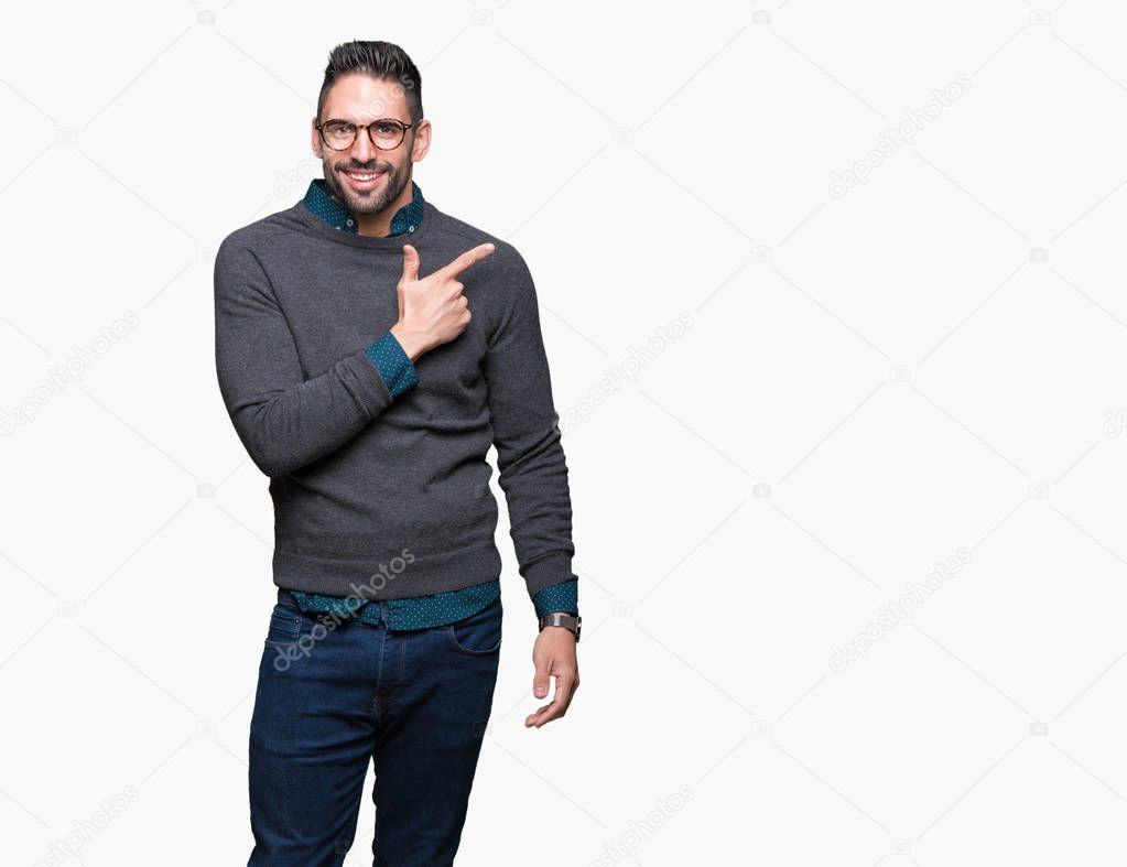 Young handsome man wearing glasses over isolated background cheerful with a smile of face pointing with hand and finger up to the side with happy and natural expression on face