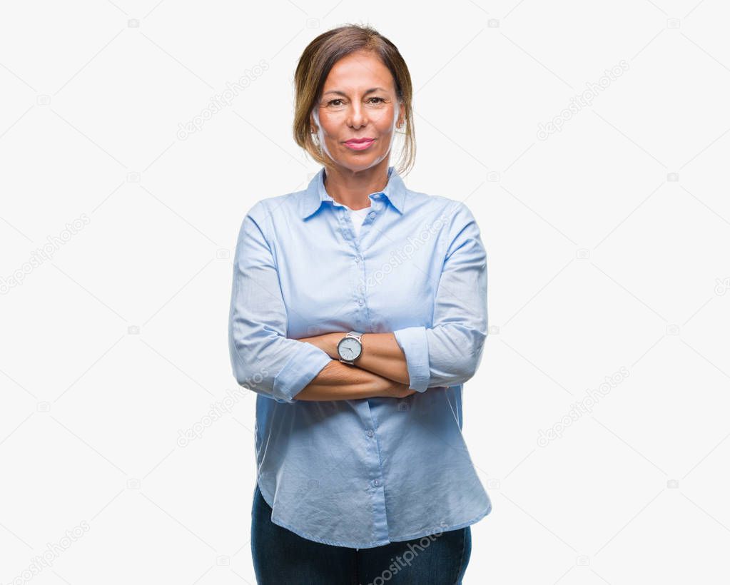 Middle age senior hispanic woman over isolated background happy face smiling with crossed arms looking at the camera. Positive person.