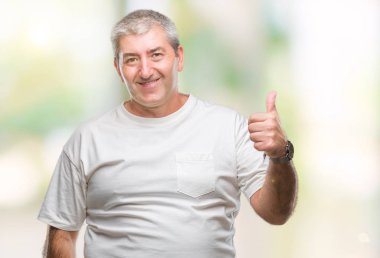 Hareketi el ile mutlu yaşasın yapıyor izole arka plan üzerinde yakışıklı komuta sizde. Kameraya bakarak başarı gösteren ile ifade onaylama.