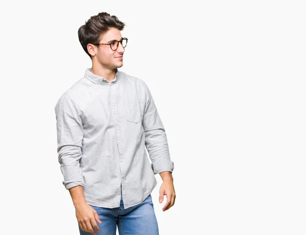 Mladý Pohledný Muž Nosí Brýle Izolované Pozadí Pohledu Daleko Stranu — Stock fotografie