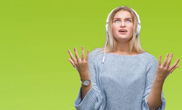 Young Caucasian Woman Listening Music Wearing Headphones Isolated Background Crazy — Stock Photo, Image