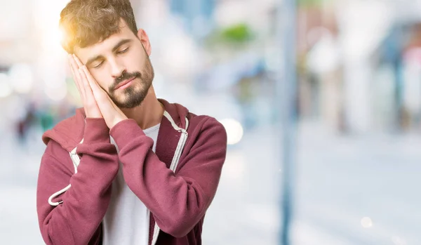 Joven Hombre Guapo Sobre Fondo Aislado Durmiendo Cansado Soñando Posando —  Fotos de Stock